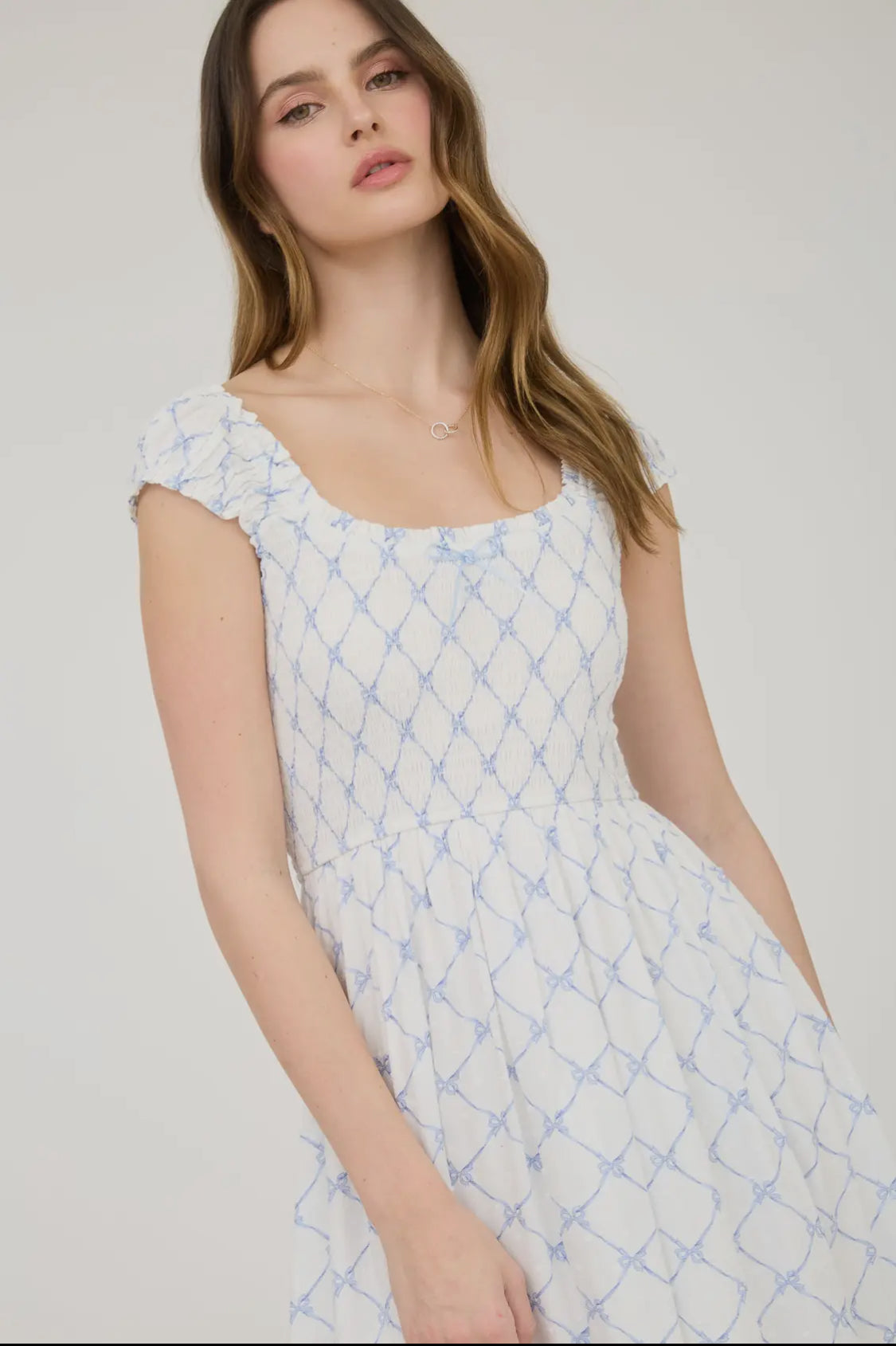 Bow pattern smocked midi dress