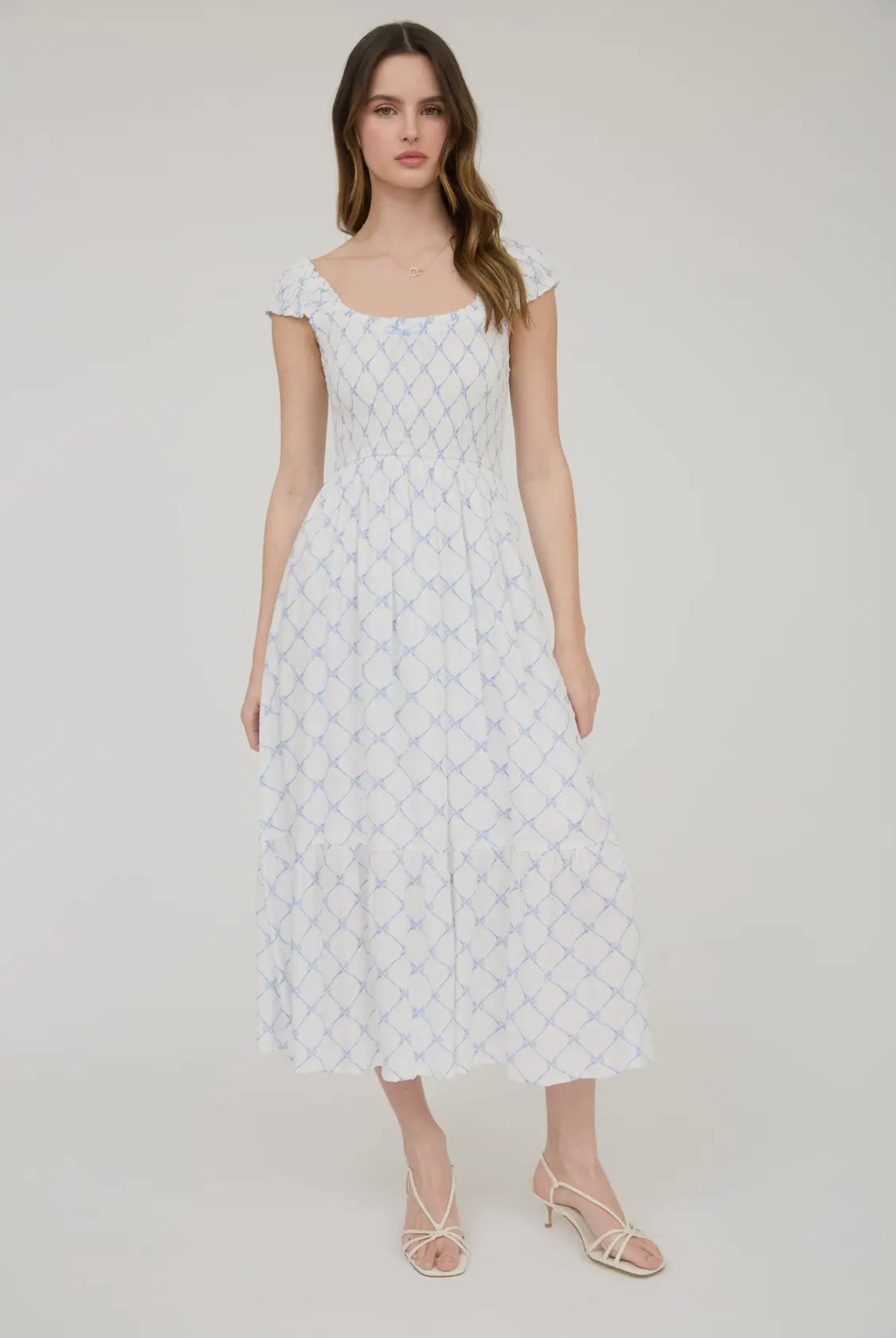 Bow pattern smocked midi dress