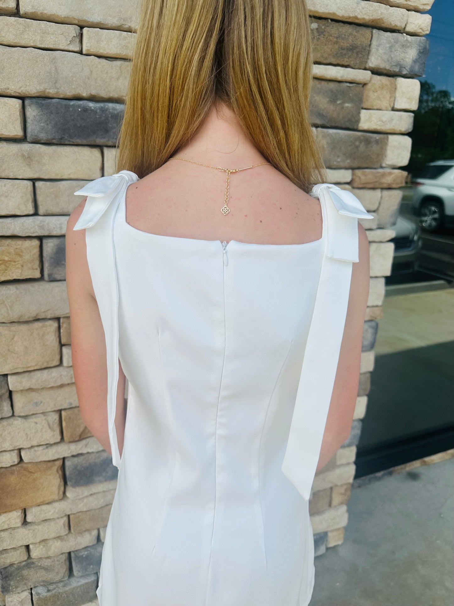 White dress with sides bows