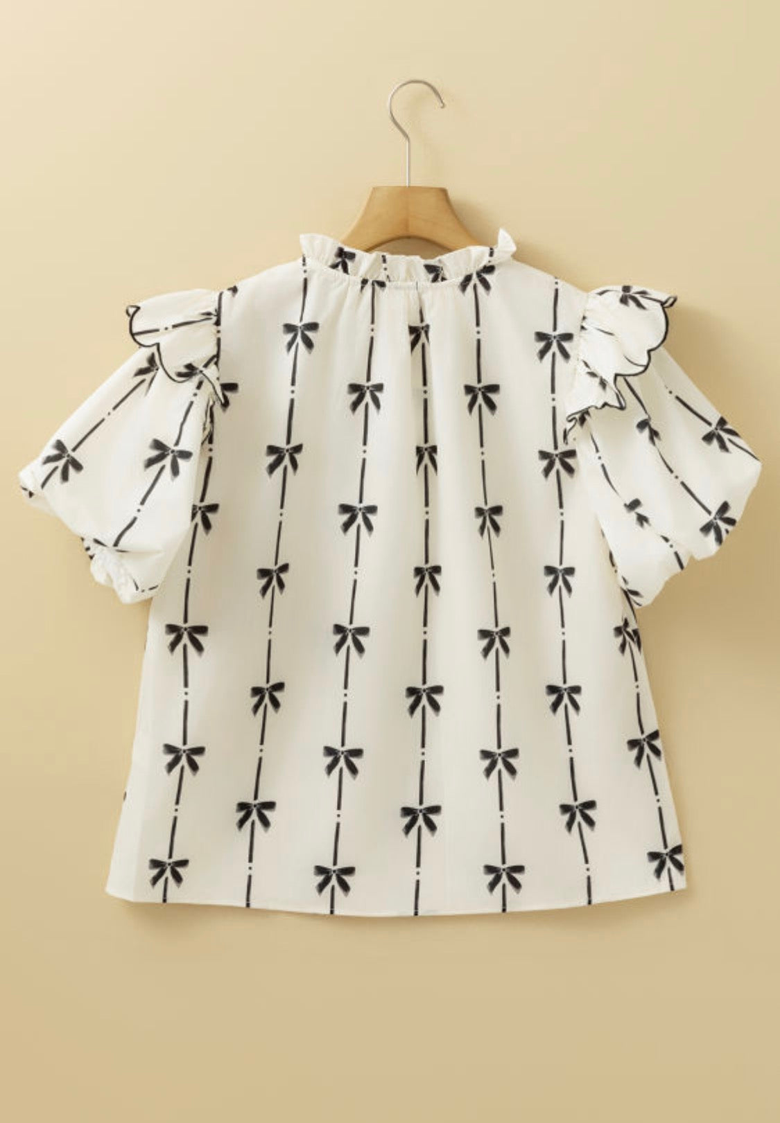 Cream bows print top