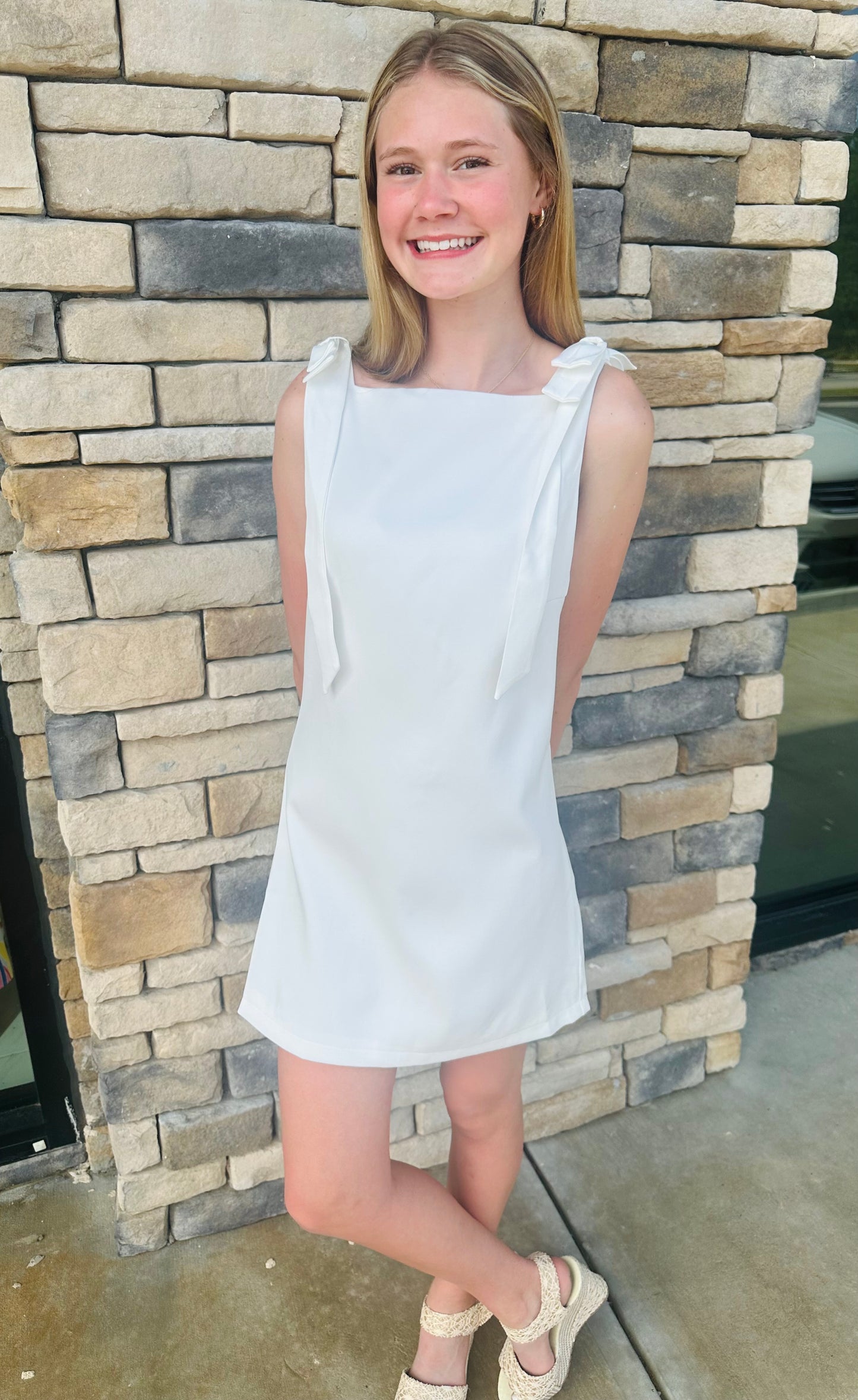 White dress with sides bows