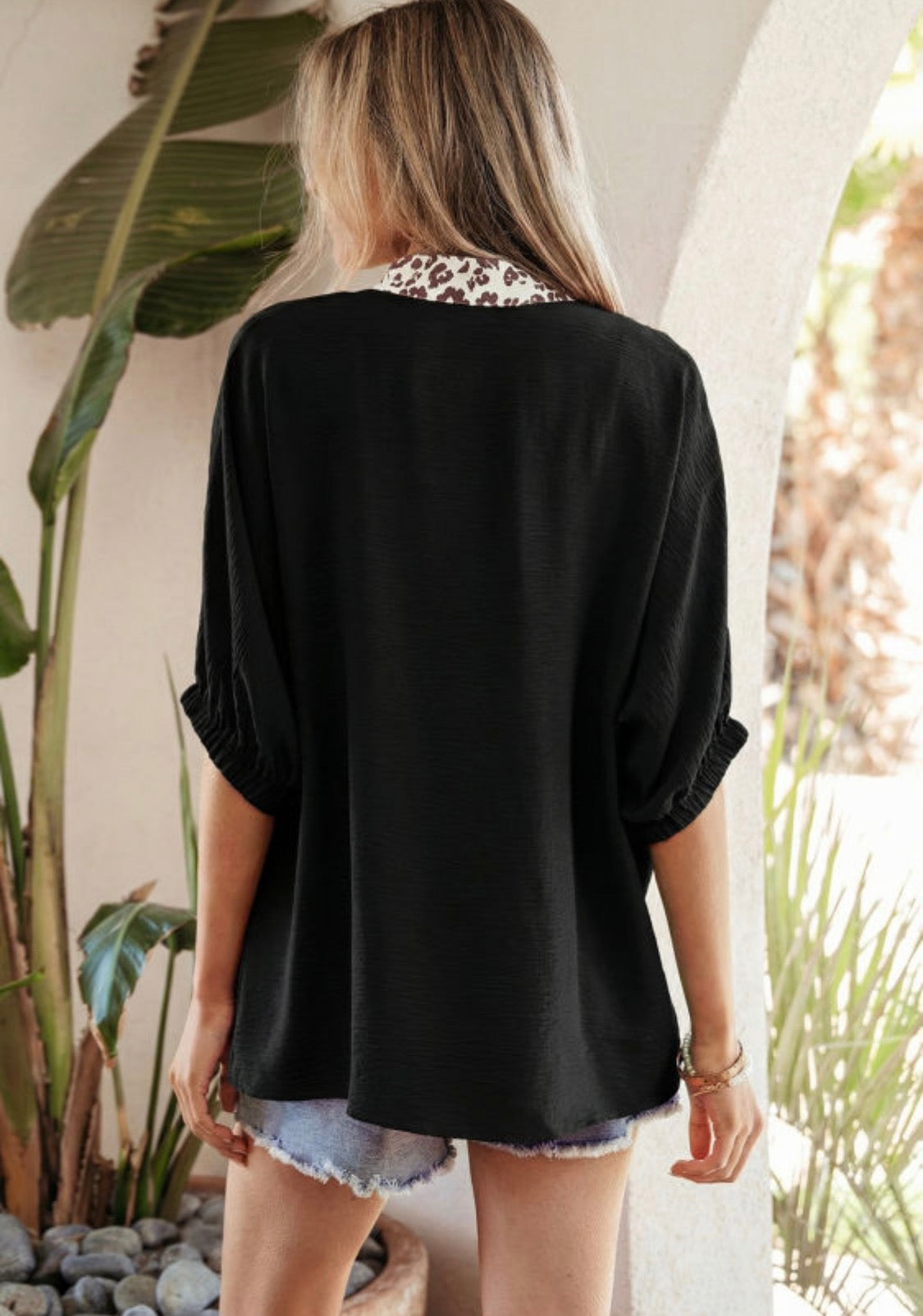 Black dolman haft sleeve leopard top