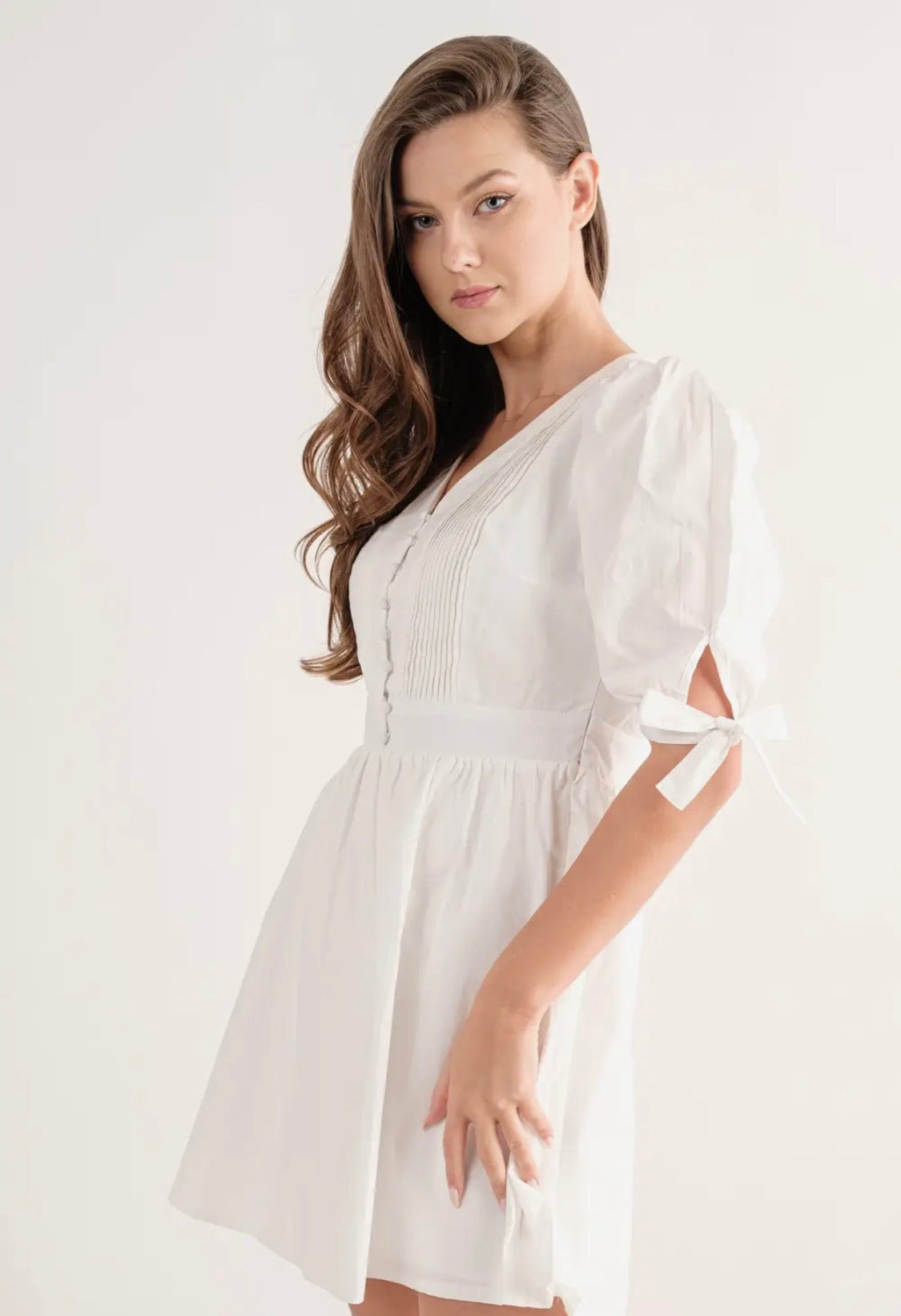 White dress bow tie on sleeve
