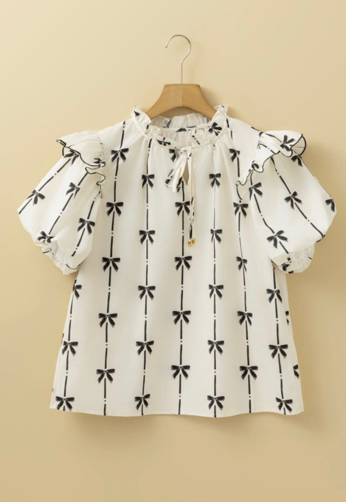 Cream bows print top