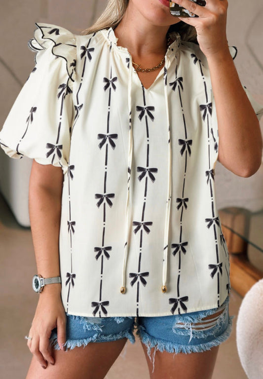Cream bows print top