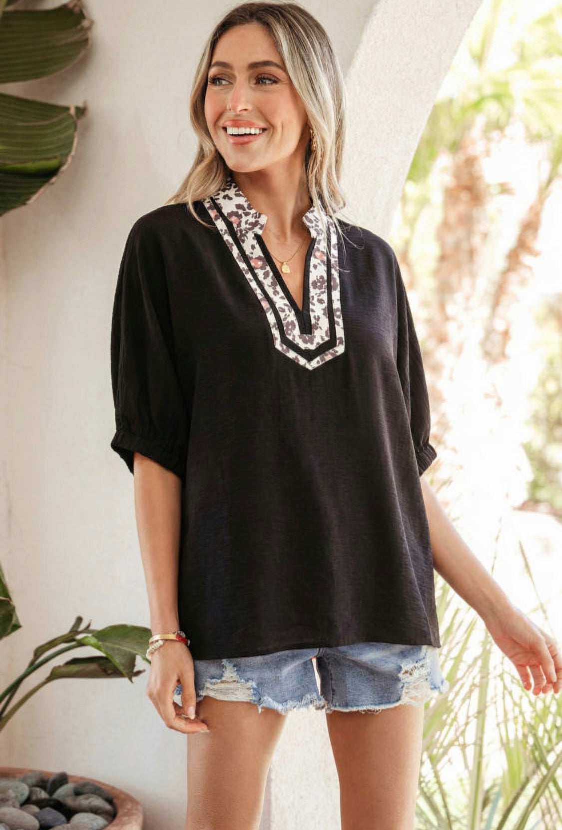 Black dolman haft sleeve leopard top