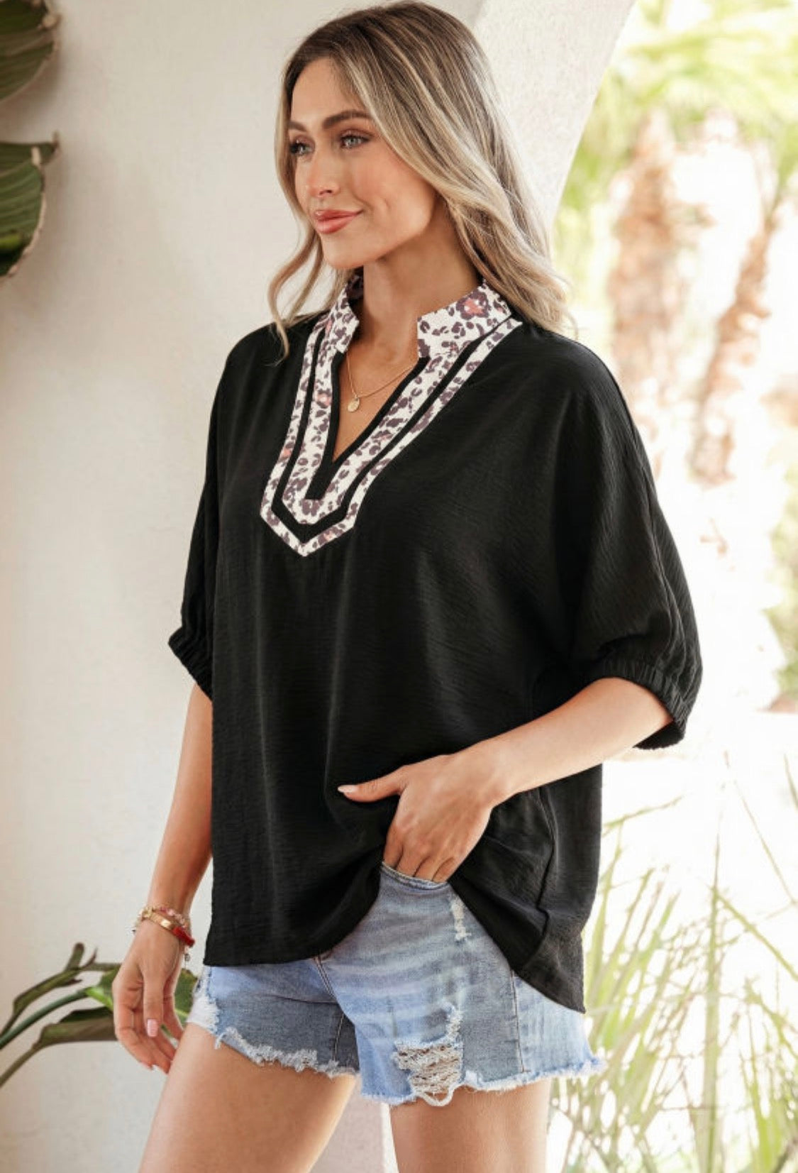 Black dolman haft sleeve leopard top