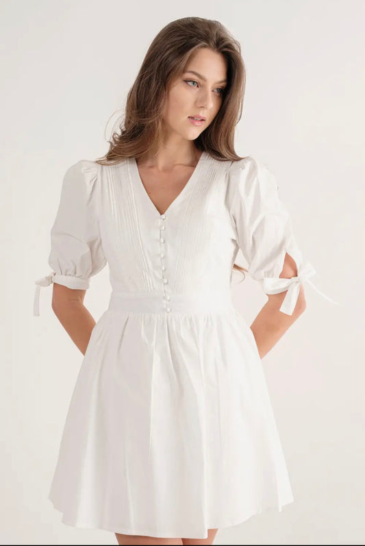 White dress bow tie on sleeve